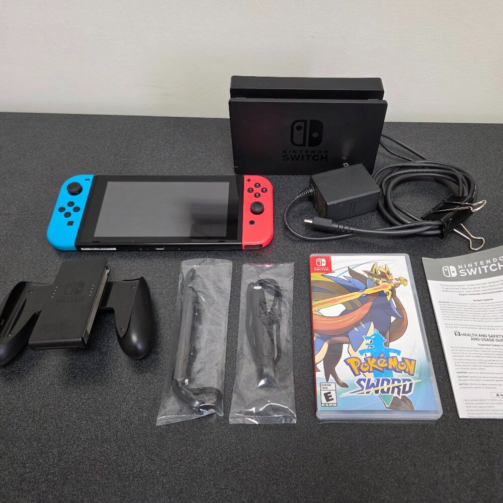 Nintendo Switch HAC-001 (-01) v2 with dock, accessories, and pokemon sword game